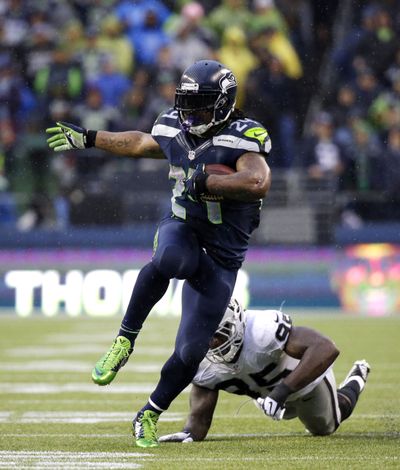 Seahawks running back Marshawn Lynch rushed for two touchdowns and led Seattle with 76 yards receiving. (Associated Press)