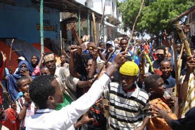 
Somalis demonstrate against high food prices Monday in the capital, Mogadishu. Troops opened fire and killed several people among tens of thousands.Associated Press
 (Associated Press / The Spokesman-Review)