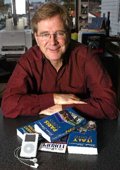 Travel guru Rick Steves at his office in Edmonds, Wash., is pictured with a few of his travel books. (Associated Press / The Spokesman-Review)