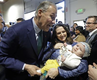 Washington Gov. Jay Inslee greets supporters, Friday, March 1, 2019, after speaking at a campaign event at A&R Solar in Seattle. Inslee announced that he will seek the 2020 Democratic presidential nomination, mixing calls for combating climate change and highlights of his liberal record with an aggressive critique of President Donald Trump. (Ted S. Warren / AP)