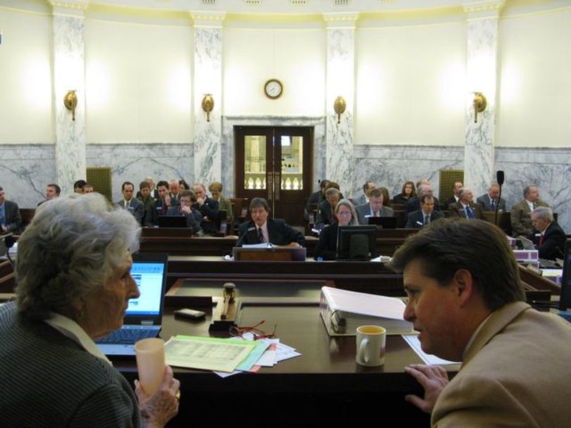 JFAC Co-Chairs Rep. Maxine Bell, R-Jerome, left, and Sen. Dean Cameron, R-Rupert, right, confer during Friday morning's meeting of the joint budget committee. The panel set a budget for the Commission on Hispanic Affairs for next year that mirrors cuts to other agencies; it didn't address Gov. Butch Otter's proposal to phase out all state funding for that commission and six other agencies over the next four years. (Betsy Russell)