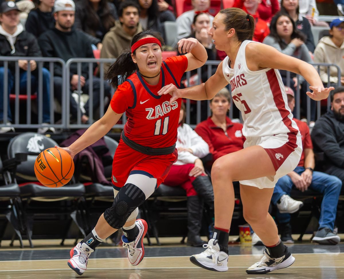 Gonzaga guard Kayleigh Truong, left, drives around Washington State guard/forward Beyonce Bea in the first half on Thursday, Oct. 9, 2023, at Beasley Coliseum in Pullman, Wash.  (Geoff Crimmins/For The Spokesman-Review)