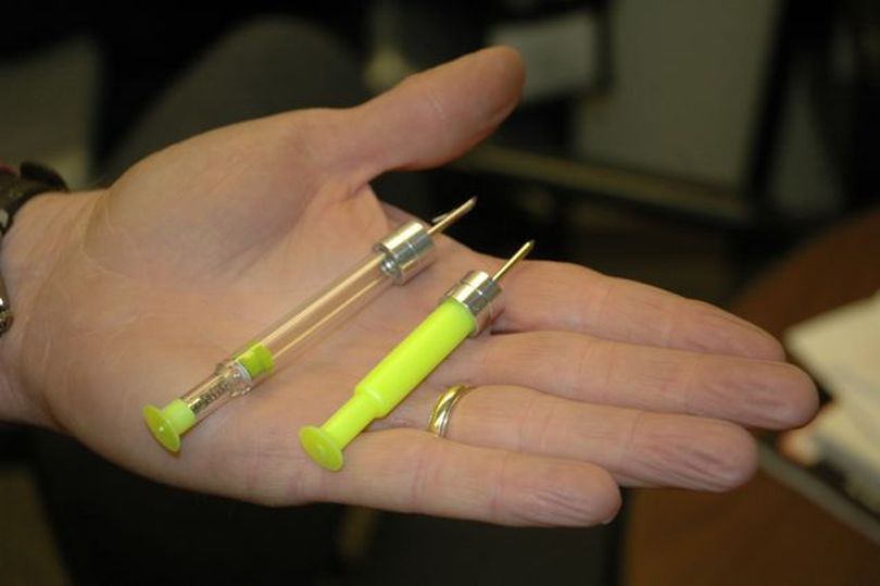 Tranquilizer darts like these were used on a large coyote that's been acting strangely in downtown Boise; despite being hit with three of the darts, the animal remains on the loose. (Courtesy photo / Idaho Fish and Game Department)