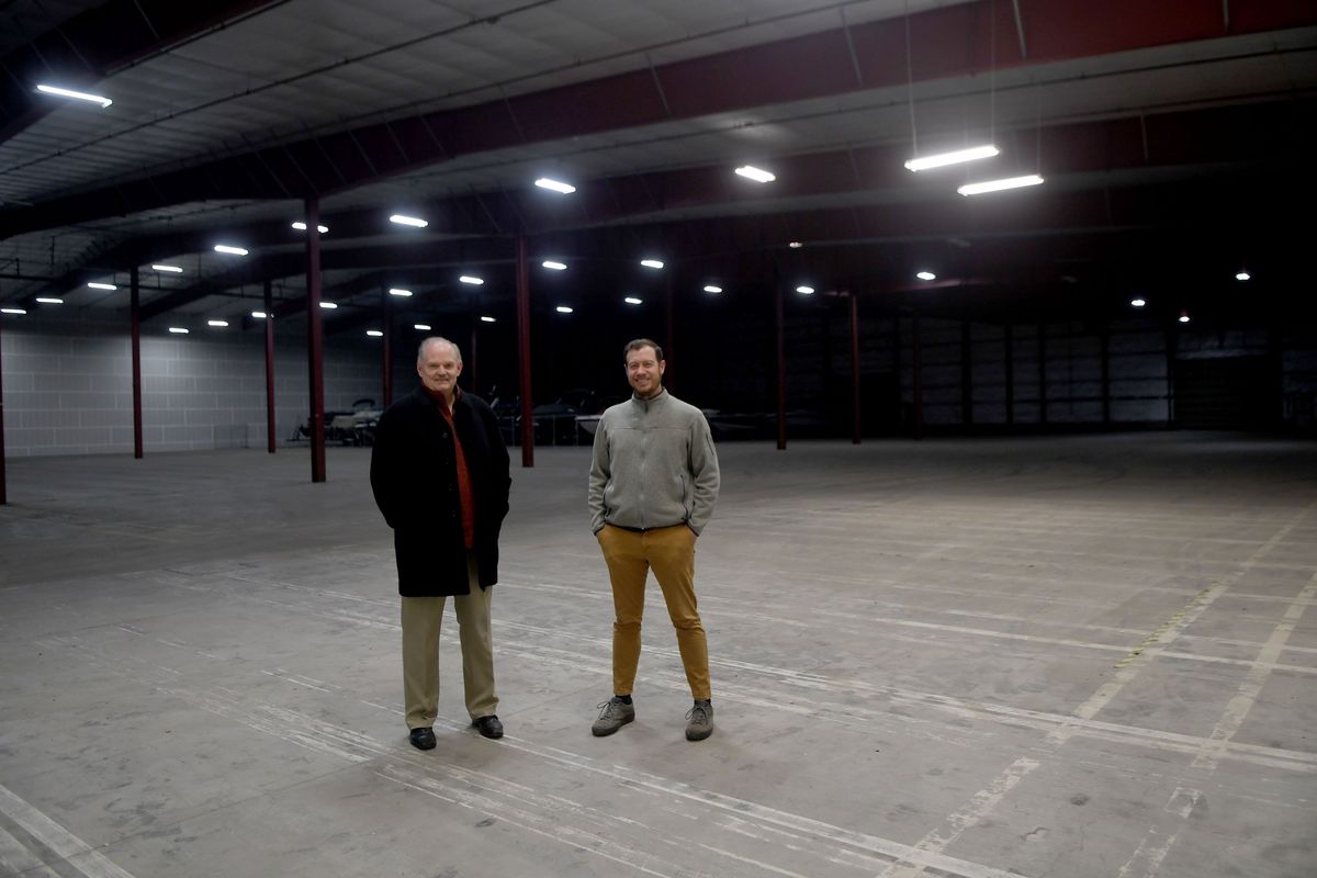 GarageSkins founder Rick Medlen and property manager Tag Jacklin stand in the company