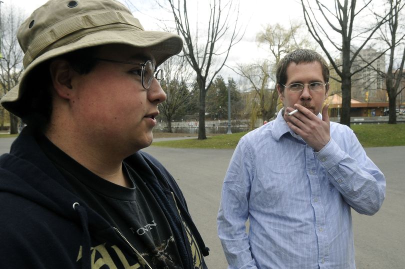 Matt Hernandez, left, doesn't smoke but is against the banning of smoking in Riverfront Park. His friend, Jason Davis, right, also does not support a ban. The two were in the park Thursday, April 9, 2009. (Dan Pelle / The Spokesman-Review)