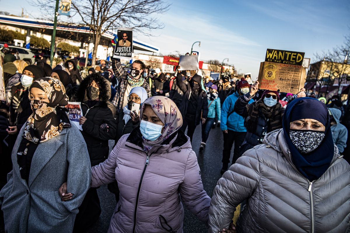 Protesters rally against police brutality, Sunday, Jan. 3, 2021, in Minneapolis, at the gas station where Dolal Idd was shot by Minneapolis police several days earlier.  (Richard Tsong-Taatarii)