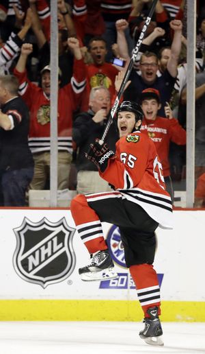 Chicago Blackhawks center Andrew Shaw celebrates after scoring the winning goal in Wednesday’s Game 1. (Associated Press)