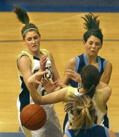 
Mead's Kami Clark, left, and Gonzaga Prep's Morgan Fiorillo, right, fight for a loose ball. 
 (Brian Plonka / The Spokesman-Review)
