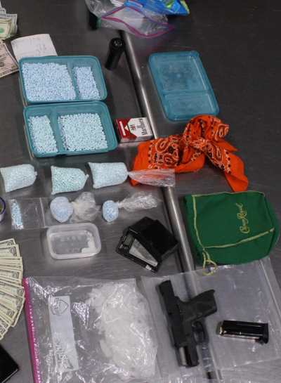 Spokane police seized fentanyl, methamphetamine and over $11,000 during a traffic stop Tuesday on East Sprague Avenue. A stolen car and a stolen gun were recovered. Dustin Besaw, 30, was booked into the Spokane County Jail on multiple charges.  (Courtesy of Spokane Police Department)