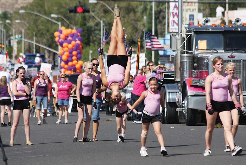 ORG XMIT: AZKIN101 Kingman's All Starz Academy members perform stunts in front of the crowd at the annual Andy Devine Days Parade in downtown Kingman, Ariz. Saturday, Sept. 26, 2009. (AP Photo/Kingman Daily Miner, JC Amberlyn) (Jc Amberlyn / The Spokesman-Review)