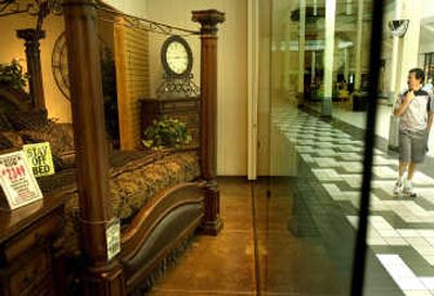 
Marvin Engene, of Kelowna, British Columbia, looks at a bedroom display at the America the Beautiful Dreamer shop in the NorthTown Mall. Shop owner Doug De Grange will soon be vacating the NorthTown location for a free-standing store on North Division Street. 
 (Ingrid Barrentine / The Spokesman-Review)