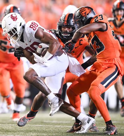 Washington State receiver De’Zhaun Stribling fights for extra yards against Oregon State on Oct. 15 in Corvallis, Ore.  (Tyler Tjomsland/The Spokesman-Review)