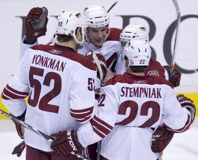 Coyotes' Taylor Pyatt, center, celebrates his game-winner. (Associated Press)