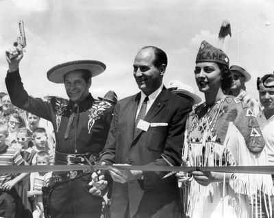 Gov. Albert D. Rosellini and Miss Spokane (Patricia Kelly) get ready to snip the ribbon opening Spokane's $6 million Maple Street toll bridge to traffic on July 1, 1958. A surprise guest at the ceremony was the governor's friend, the Cisco Kid (Duncan Renaldo) of television fame.  (Photo Archive/The Spokesman-Review)