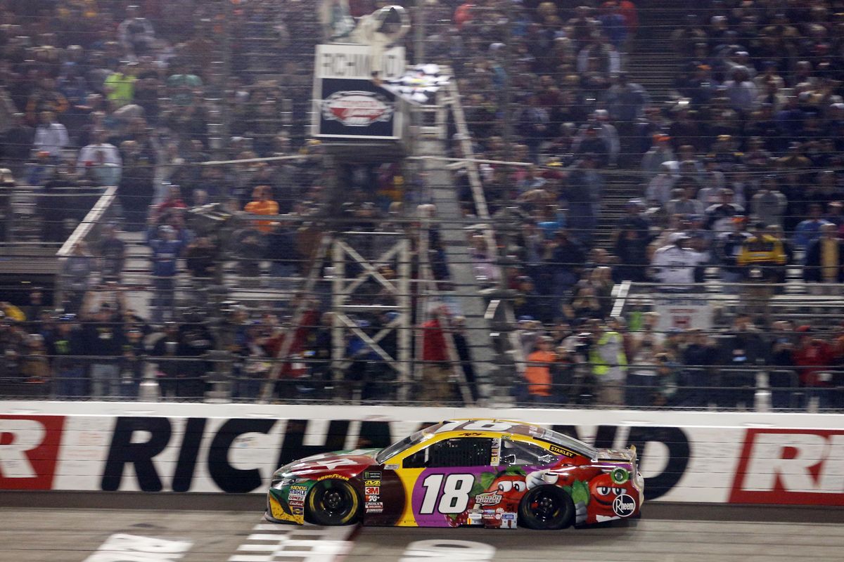 Kyle Busch crosses the finish line to win the NASCAR Cup Series auto race at Richmond Raceway in Richmond, Va., Saturday, April 21, 2018. (Steve Helber / Associated Press)