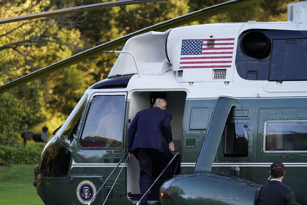 President Donald Trump boards Marine One as he leaves the White House to go to Walter Reed National Military Medical Center after he tested positive for COVID-19, Friday, Oct. 2, 2020, in Washington.  (Alex Brandon)