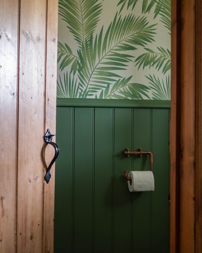 Wallpaper and wainscotting make a small bathroom pop.  (Shutterstock)