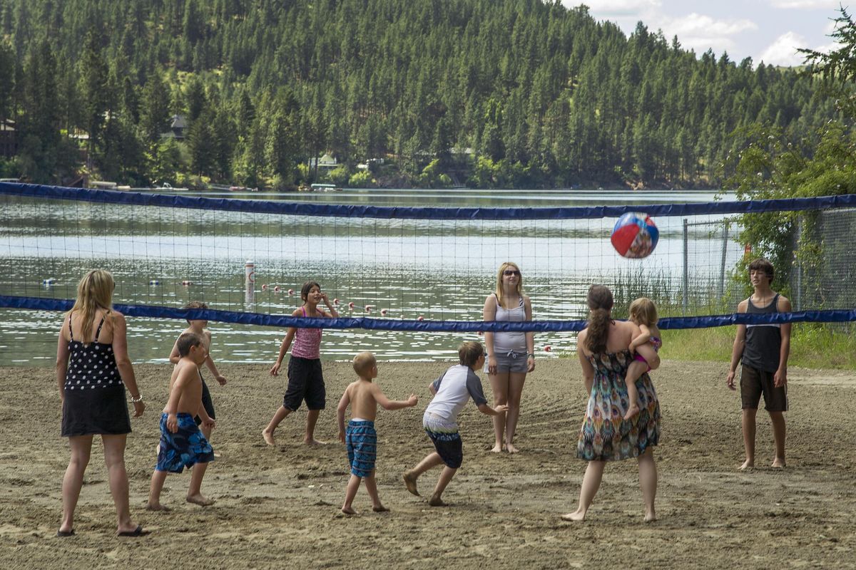 A game of volleyball is played on the beach at Liberty Lake Park Wednesday, June 27, 2012. The park is one of the largest county parks in the the state at 3000 acres of forest, mountainous areas, public beach and campground. (Colin Mulvany / The Spokesman-Review)