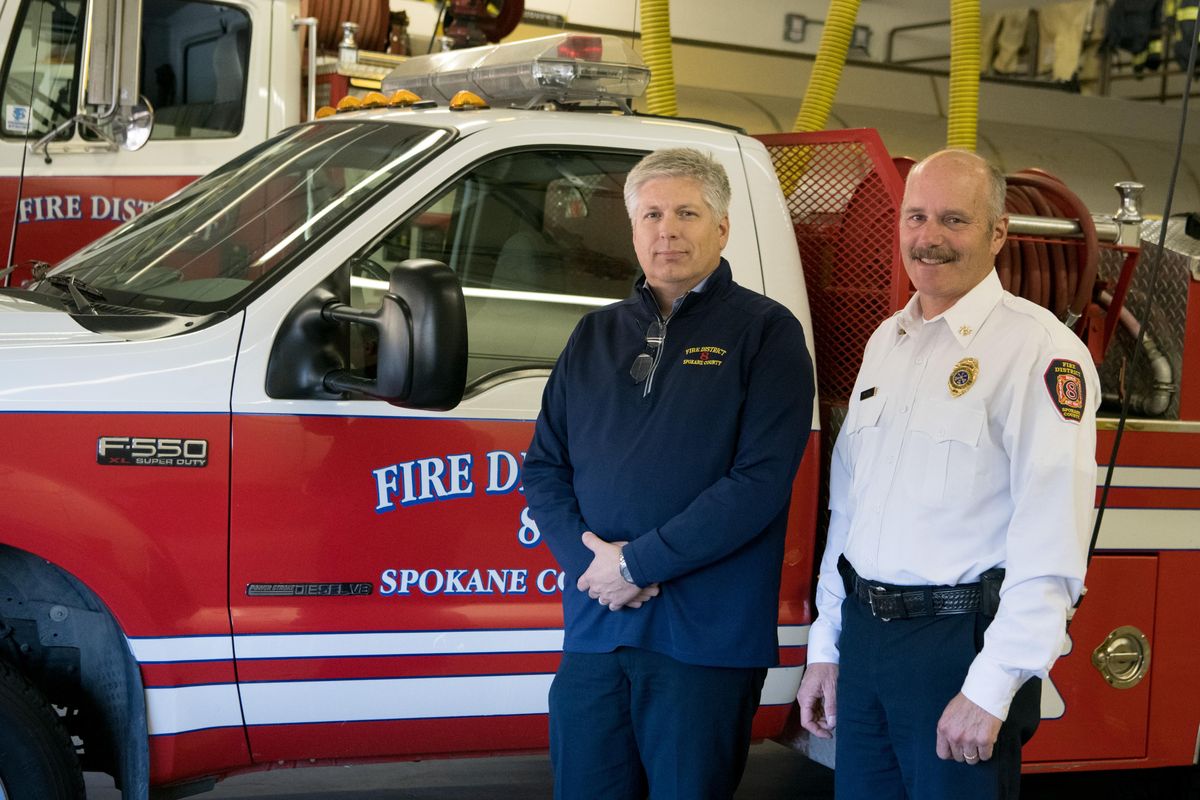 Fire Chief Tony Nielsen, left, and Division Chief Marty Long of Spokane County Fire District 8, are photographed  Thursday, Oct. 18, 2018, at the station  in Valleyford, Wash.  Long helped represent the district at the Fire Department Exchange  with districts from four other states to exchange ideas about wildland firefighting.. (Tyler Tjomsland / The Spokesman-Review)