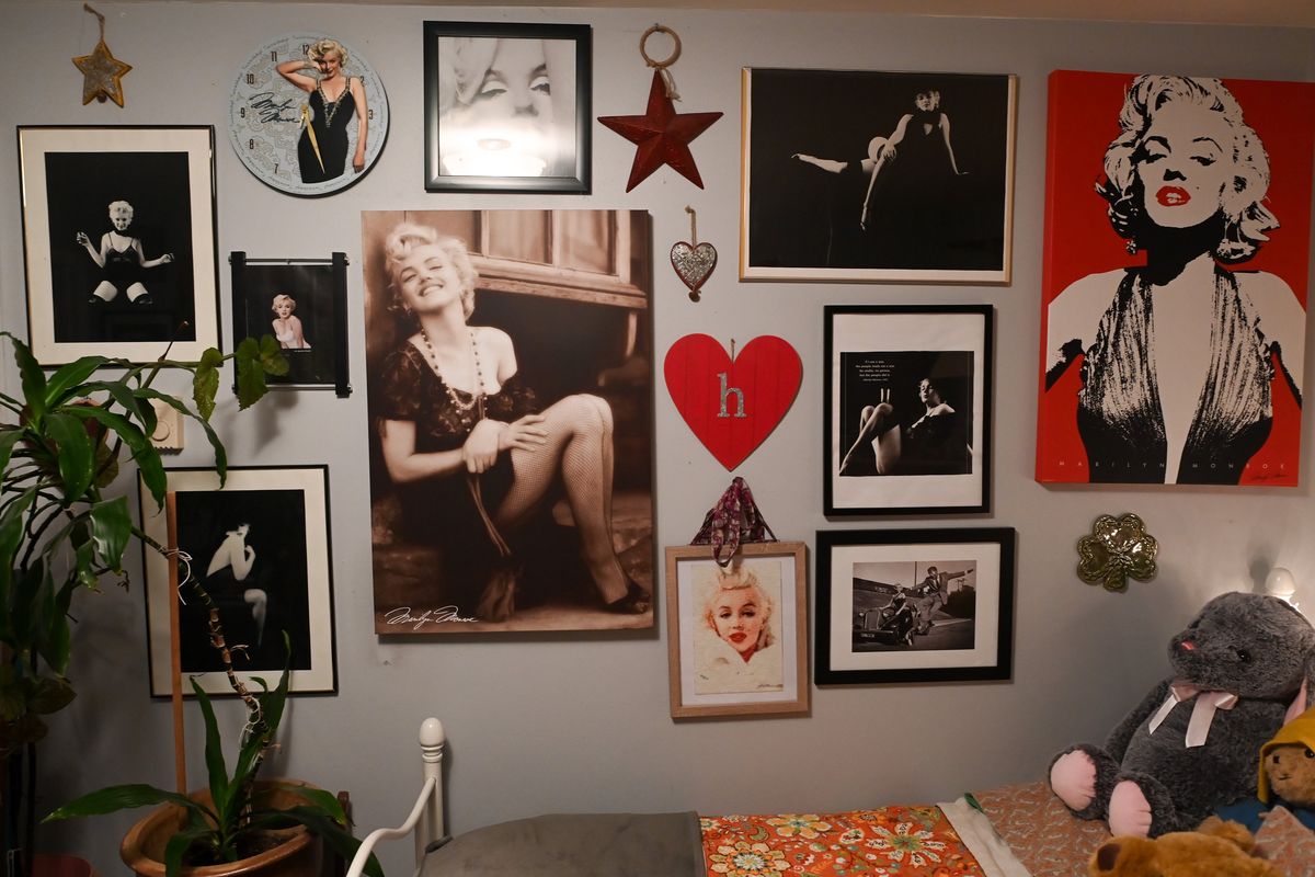 Heather Clarke shows some of her Marilyn Monroe photos and paintings on Tuesday, Feb 1, 2022, at her home in Spokane, Wash.  (Tyler Tjomsland/The Spokesman-Review)