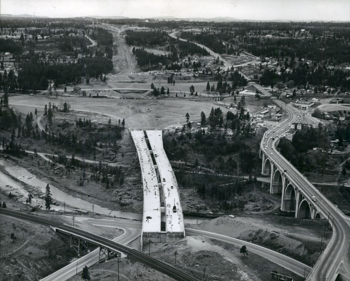 1963: The highway bridge over Latah Creek was one of the first pieces of Interstate 90 to be completed on the route through Spokane. It would take almost two decades to acquire the land, clear the route and pave the highway through Spokane and North Idaho, connecting Seattle to Boston. Before I-90, east-west traffic through town took the Sunset Highway, over an earlier Latah Creek bridge, at far right, which took traffic on surface streets through downtown.  (Spokesman-Review photo archives)