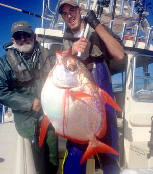 Washington state-record opah, also called moonfish, caught out of Westport on Sept. 27, 2015, weighs 36 pounds. At left is angler Jim Watson of Coeur d'Alene and deckhand Joel Torrison of All Rivers & Saltwater Charters.  (Courtesy)