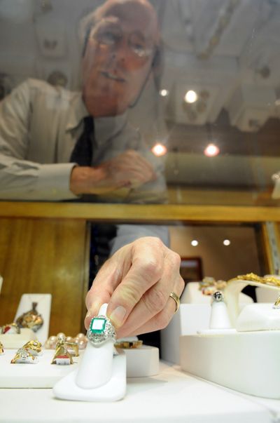 Penn Fix of Dodson’s Jewelers shows off an emerald ring of more than six carats Wednesday. Although most can’t afford the giant emerald, Fix is cautiously optimistic that consumers will spend a little more this holiday season.  (Jesse Tinsley)