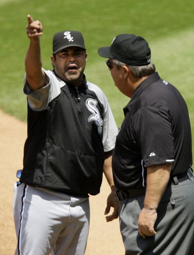 White Sox manager Ozzie Guillen argues with umpire Joe West after Guillen was ejected on Wednesday.  (Associated Press)