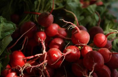 
Fresh produce, such as radishes, are among the many varieties of foods found at the Kootenai County Farmers' Market. 
 (Brian Plonka / The Spokesman-Review)