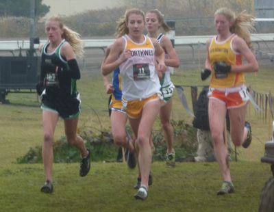 Katie Knight, middle, runs toward a third-place finish.