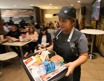 In an effort to boost customer spending, McDonald’s has added more expensive “signature crafted” sandwiches and is pushing its McPick 2 menu. (Stuart Ramson / AP Images for McDonald's)