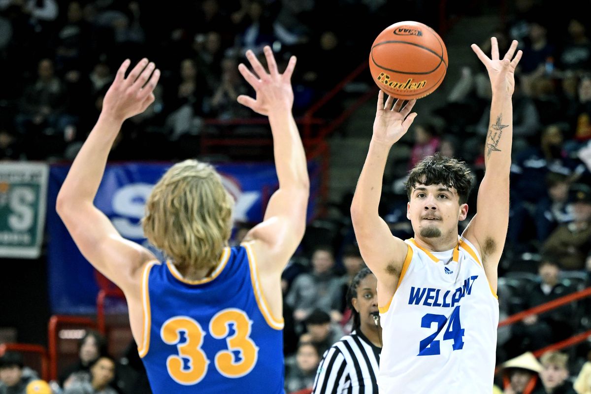 Willpinit’s Jordan Montgomery (24) shoots the ball from three-point range over Columbia Adventist’s Tristan White (33) during the first half of a WIAA State 1B quarterfinal high school basketball game, Thursday, Feb. 29, 2024, in the Spokane Veterans Arena.  (COLIN MULVANY)