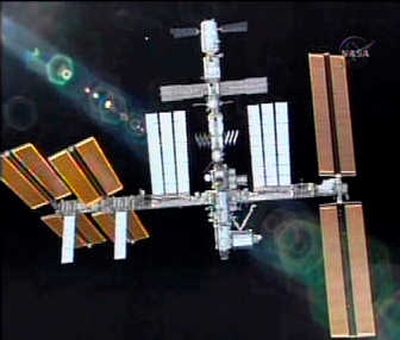 
In this image from NASA TV, a view of the International Space Station is seen from the shuttle Discovery as it approaches for docking Monday. Associated Press
 (Associated Press / The Spokesman-Review)