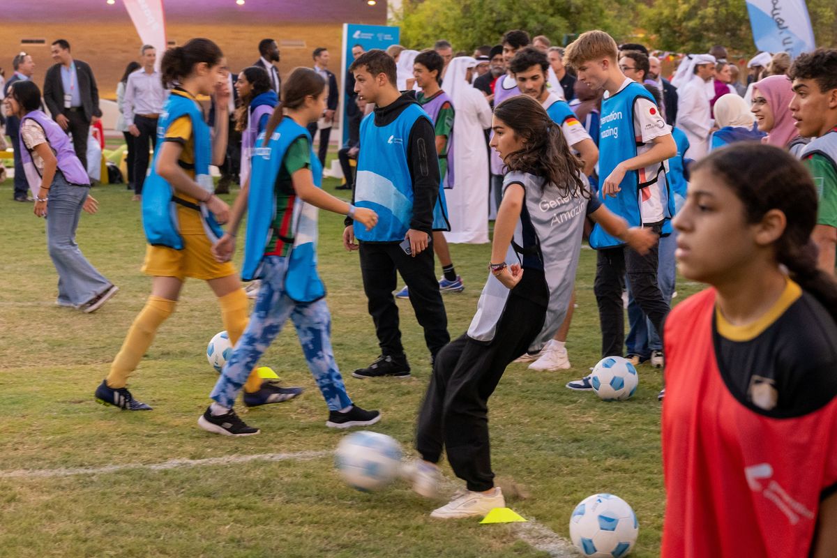 Young soccer players kick balls during a sports diplomacy event hosted by U.S. Secretary of State Antony J. Blinken in Doha, Qatar, on Nov. 21.  (Ron Przysucha/U.S. Department of State/TNS/TNS)