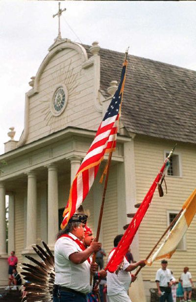 
Coeur d'Alene tribal members make their way past the Cataldo Mission  as part of the Feast of the Assumption celebration. The event takes place every August.
 (File / The Spokesman-Review)