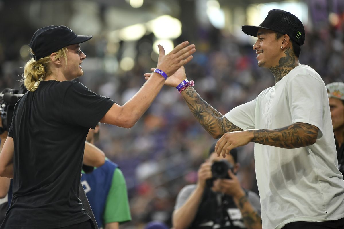 In this July 15, 2017 photo, Alex Majerus, left, high-fives Nyjah Huston after Majerus