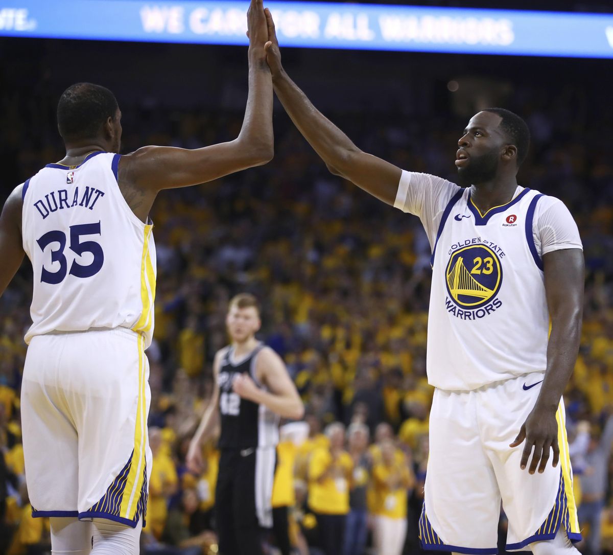Golden State Warriors’ Kevin Durant (35) and Draymond Green celebrate in the final seconds of Game 5 of the team’s first-round NBA basketball playoff series against the San Antonio Spurs on Tuesday, April 24, 2018, in Oakland, Calif. The Warriors won 99-91, eliminating the Spurs from the playoffs. (Ben Margot / Associated Press)