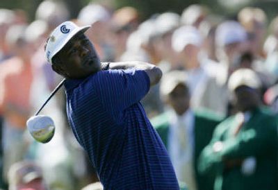 
First-round leader Vijay Singh, who fired a 5-under-par 67, drives off the first tee during Thursday's opening round of the 70th Masters at Augusta, Ga. 
 (Associated Press / The Spokesman-Review)