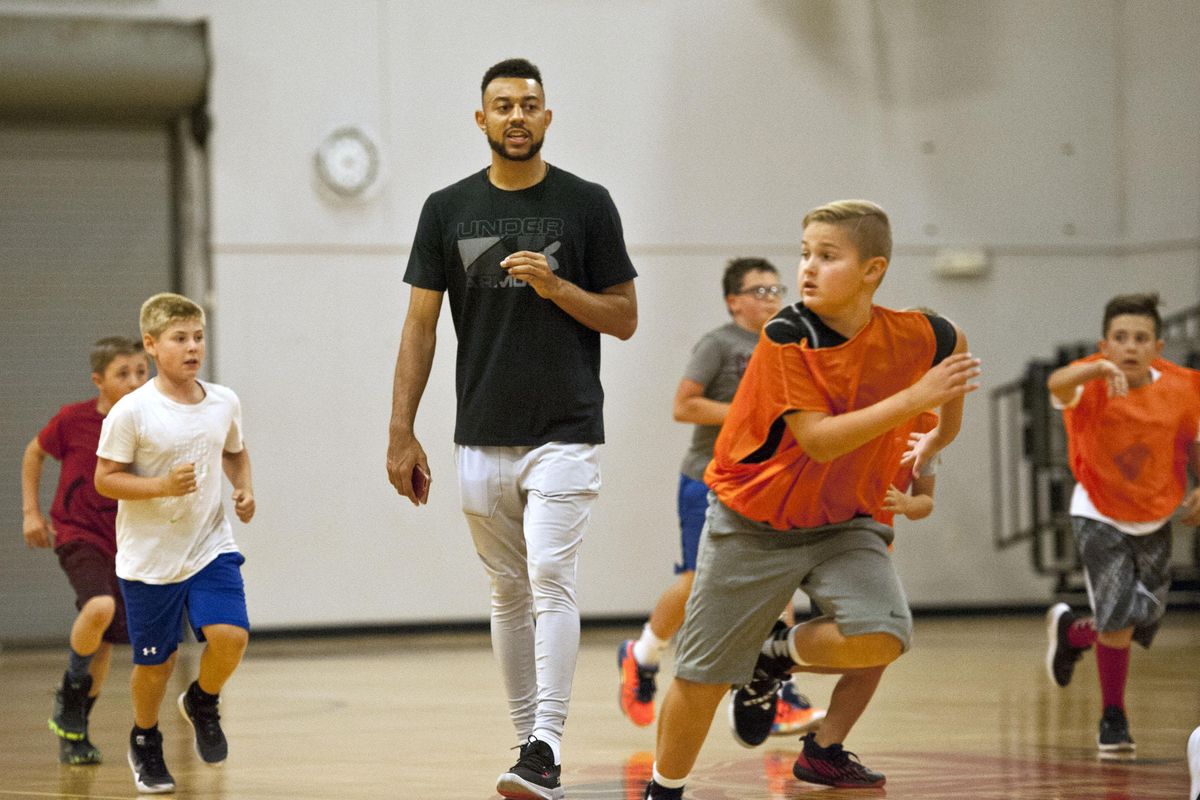 Former Gonzaga star Nigel Williams-Goss gives instruction during his annual basketball camp at The Hub in Liberty Lake on Tuesday, August 6, 2019. (Kathy Plonka / The Spokesman-Review)