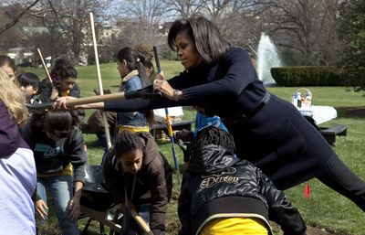 First lady Michelle Obama takes part in groundbreaking of the White House Kitchen Garden on  Friday with students from Washington’s Bancroft Elementary School.  (Associated Press / The Spokesman-Review)