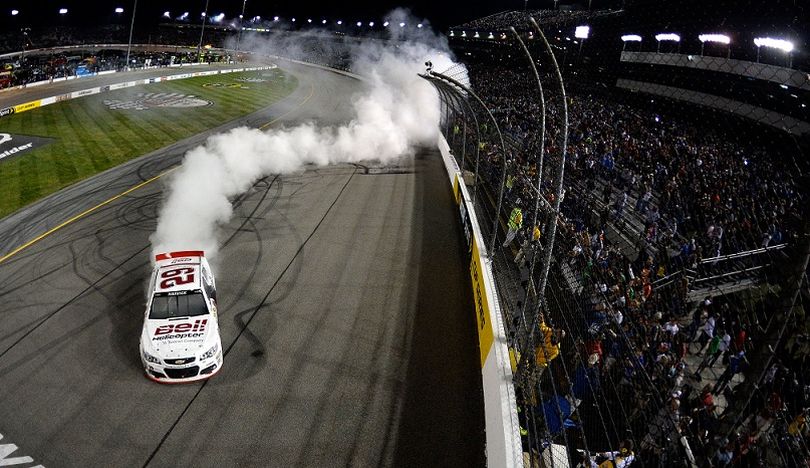 Kevin Harvick, driver of the #29 Bell Helicopter Chevrolet, celebrates with a burnout after winning the NASCAR Sprint Cup Series Toyota Owners 400 at Richmond International Raceway on April 27, 2013 in Richmond, Virginia. (Photo by Jared C. Tilton - Pool/Getty Images)  (Getty Images North America)