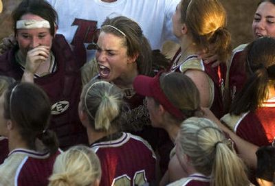 
University girls softball players celebrate after handing Shadle Park its first loss of the season and clinching the district championship.
 (Jed Conklin / The Spokesman-Review)