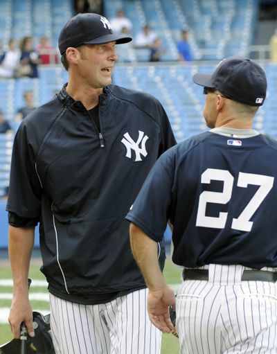 Associated Press Richie Sexson, left, talks with Yankees manager Joe Girardi before Friday’s game. (Associated Press / The Spokesman-Review)