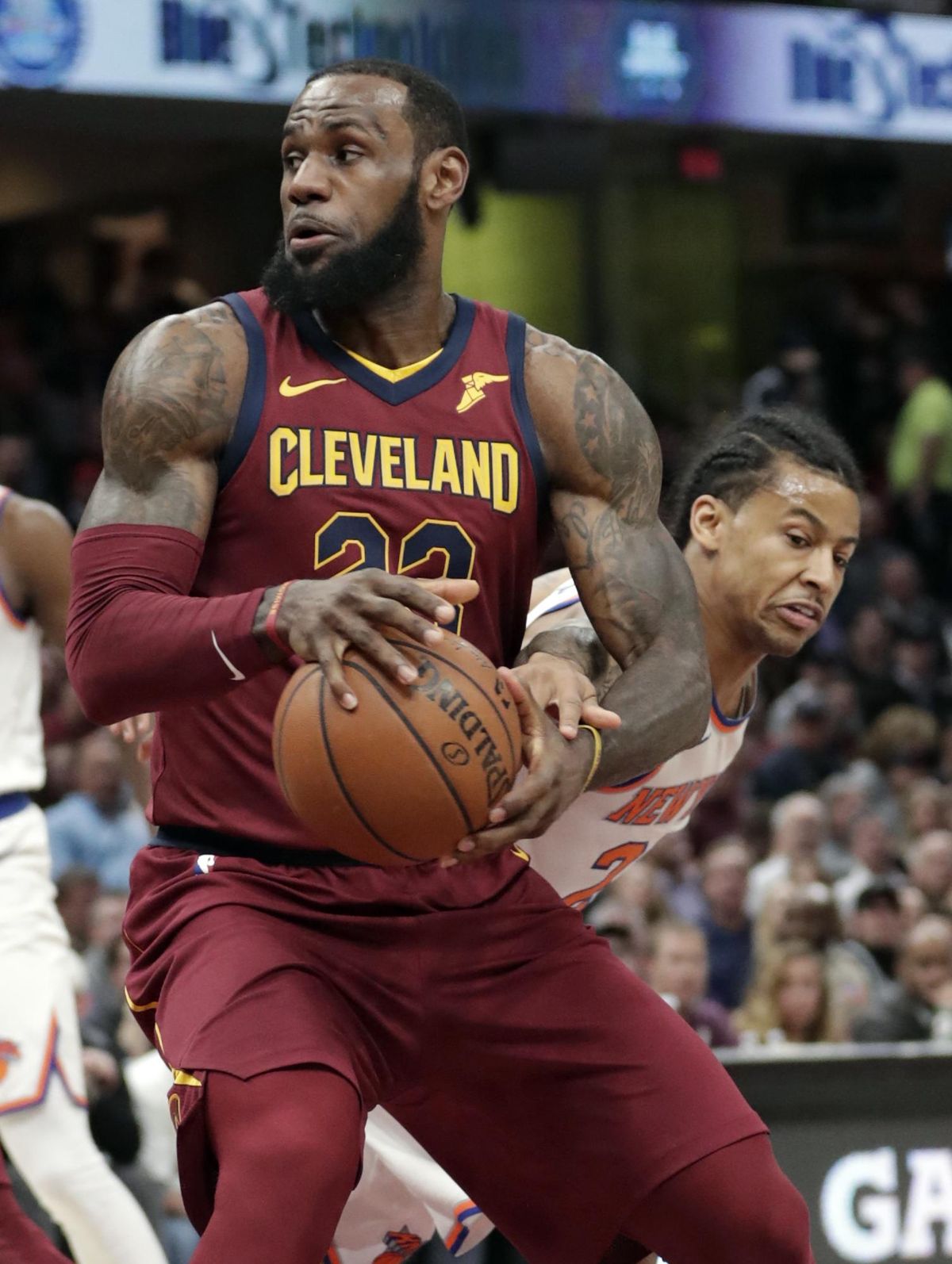 Cleveland Cavaliers’ LeBron James, left, drives past New York Knicks’ Trey Burke in the first half of an NBA basketball game, Wednesday, April 11, 2018, in Cleveland. (Tony Dejak / Associated Press)