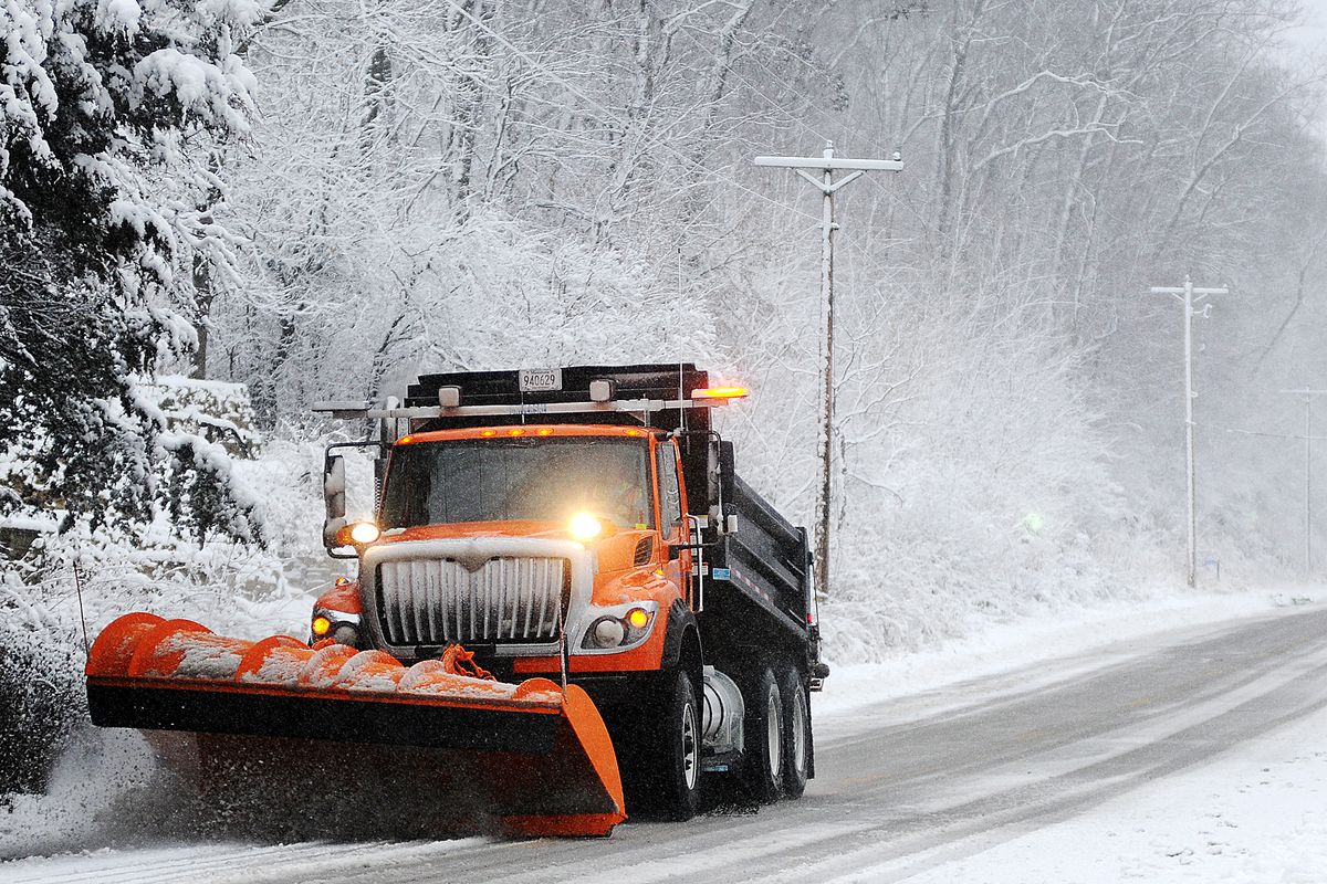 A snow plow clears off Old Homer Road, Sunday, Dec. 9, 2012, near Winona, Minn. The National Weather Service is predicting a total accumulation of five to 10 inches by Monday morning. (Joe Ahlquist / Winona Daily News)