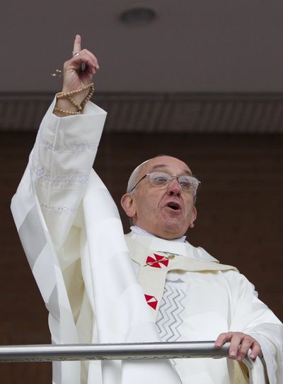 Pope Francis comments on the rain at the Aparecida basilica in Aparecida, Brazil, Wednesday. (Associated Press)