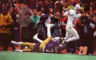 
This moment ranks as No. 5: Chris Jackson runs over Tony Parrish and goes in for a touchdown against the Huskies in the 1997 Apple Cup, a 41-35 Cougar win in Seattle. 
 (Christopher Anderson / The Spokesman-Review)