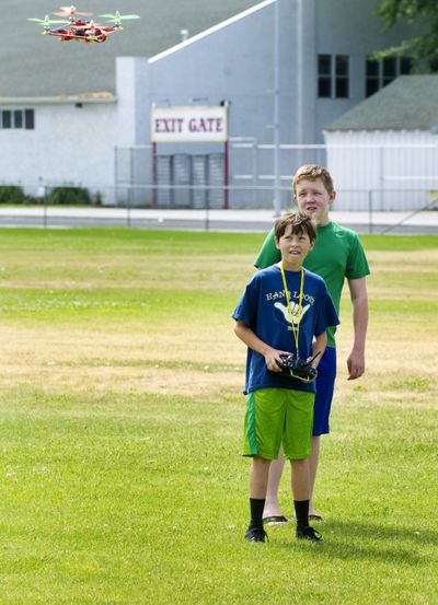 Taking flight: Sager Middle School’s Garrett Green, 13, flies his quadcopter made of Lego Connect during summer camp Tuesday at Garrison Middle School in Walla Walla. (Associated Press)