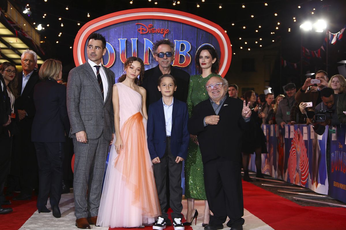 Actors Colin Farrell, from left, Nico Parker, Tim Burton, Finley Hobbins, Eva Green and Danny DeVito pose for photographers upon arrival at the premiere of the film 