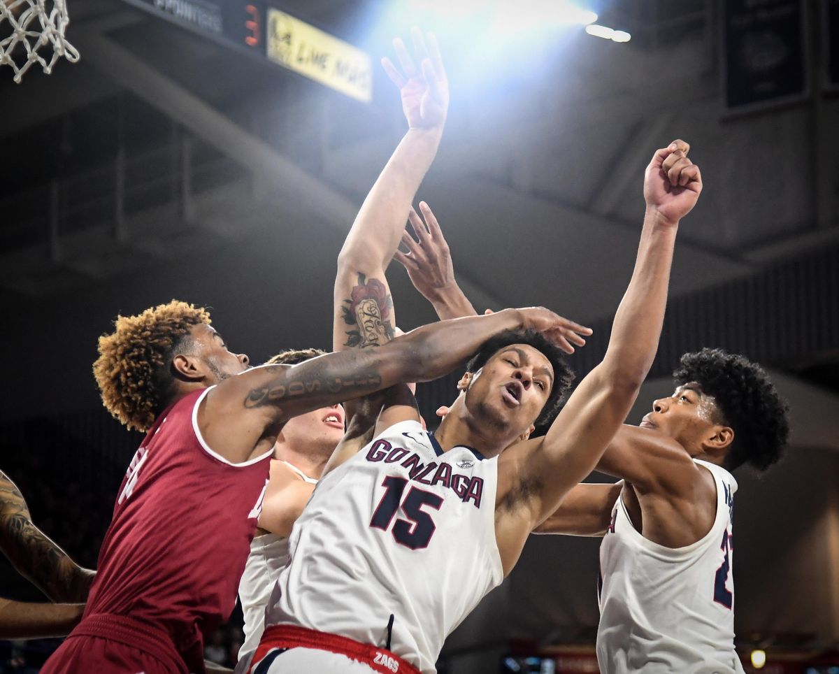 Gonzaga forward Brandon Clarke takes a shot to the head from Denver guard Ade Murkey, Friday, Dec. 21, 2018, in the McCarthey Athletic Center. (Dan Pelle / The Spokesman-Review)
